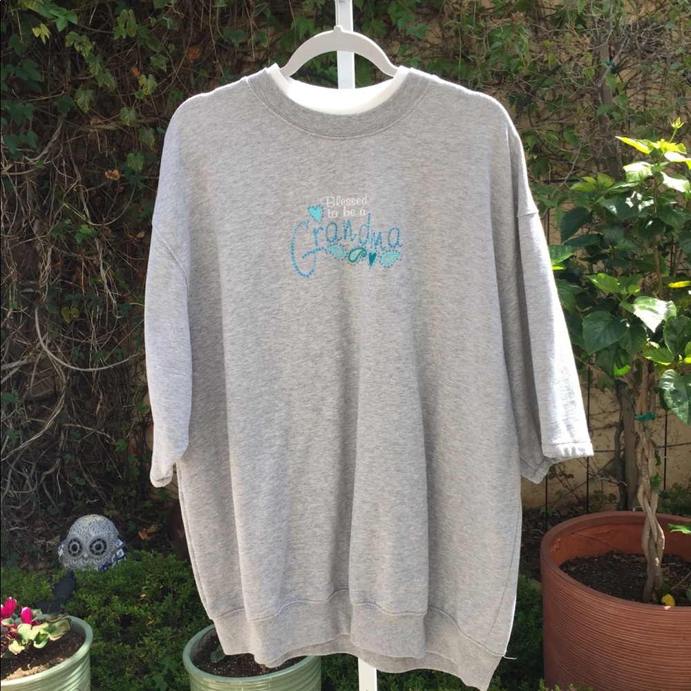 MC SPORTWEAR,Lite gray Sweatshirt W/ saying .